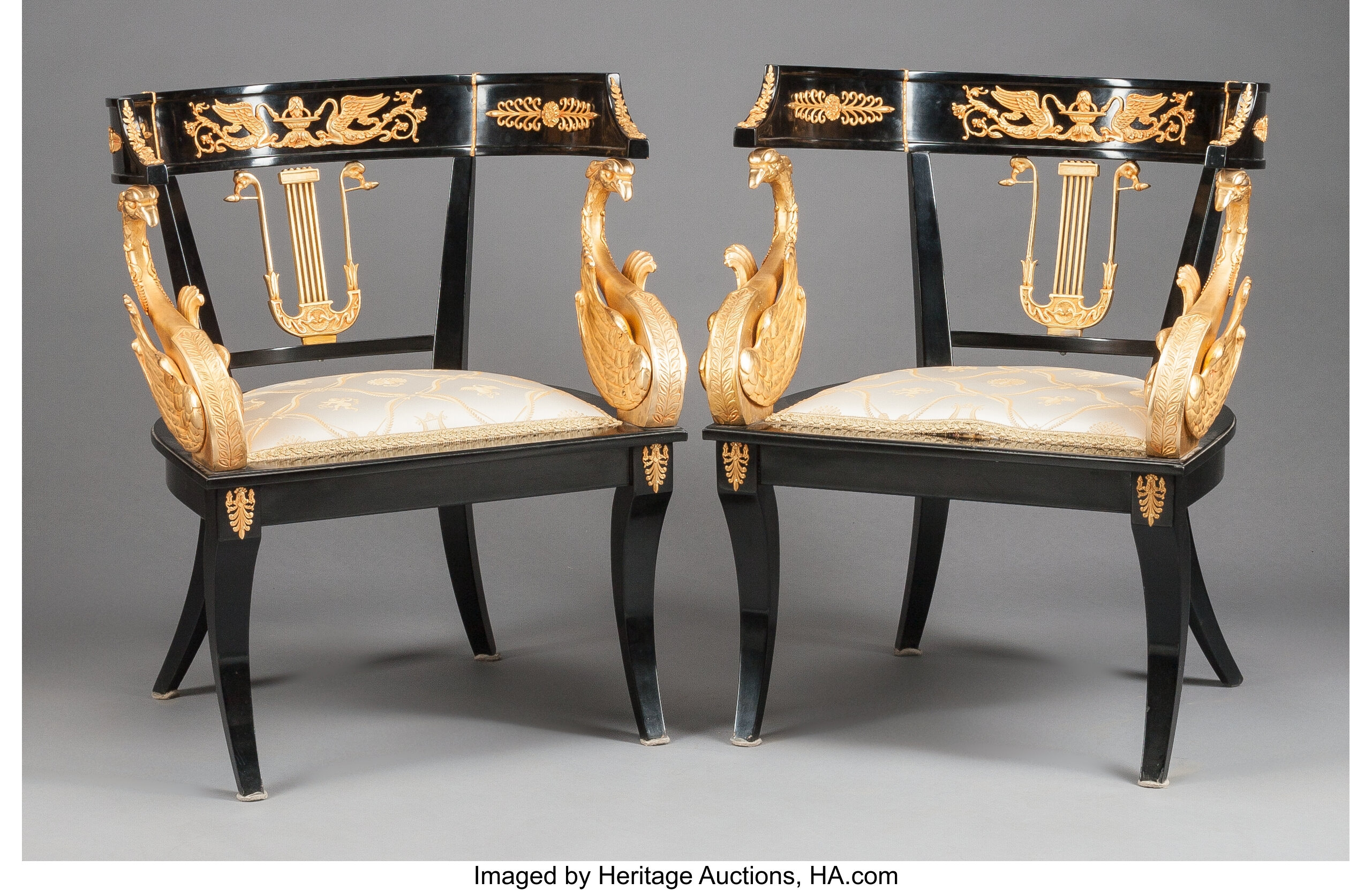 A PAIR OF FRENCH EMPIRESTYLE EBONIZED WOOD AND GILT BRONZE MOUNTED