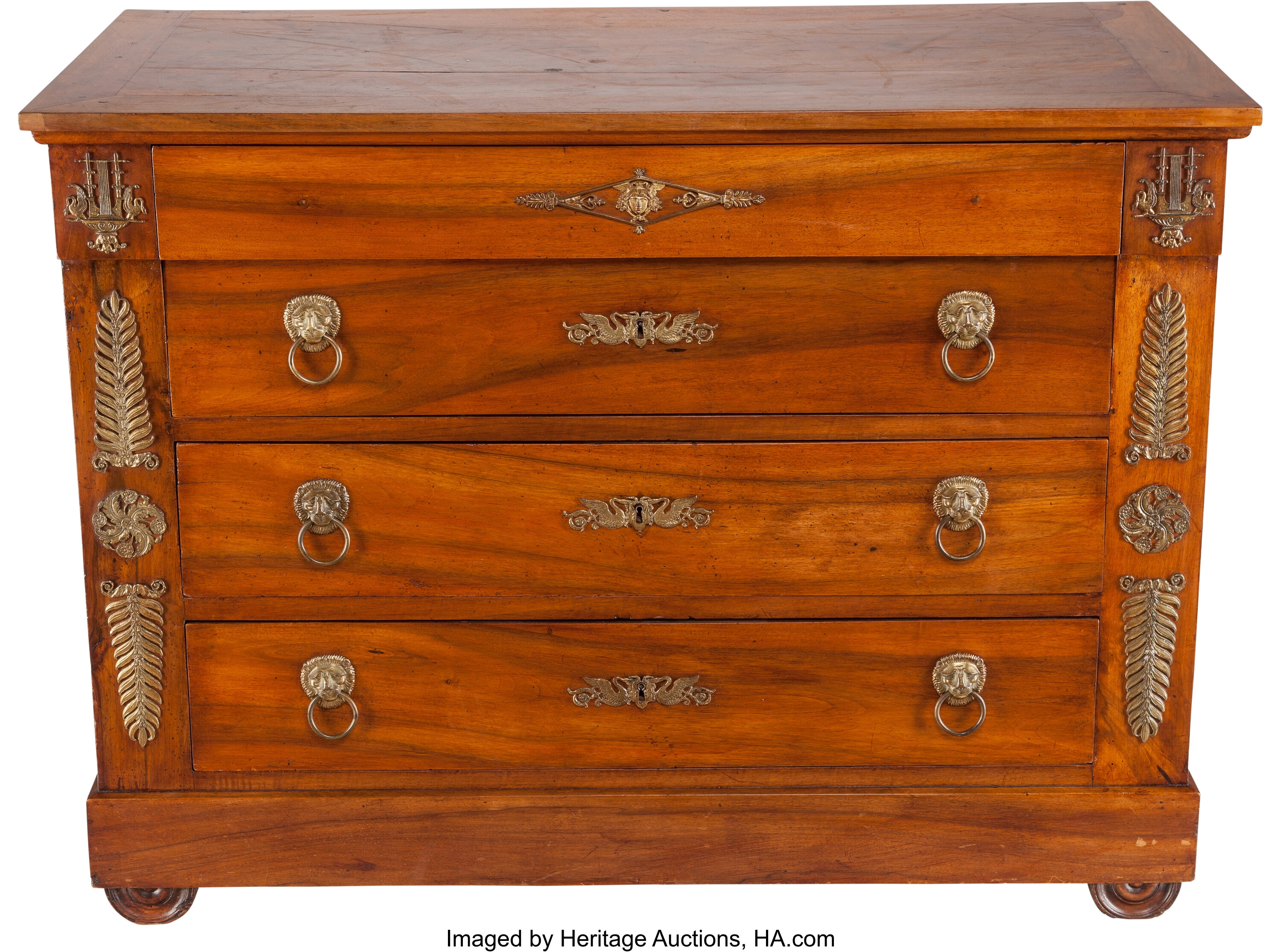 An Empire Style Gilt Bronze Mounted Fruitwood Four Drawer Commode