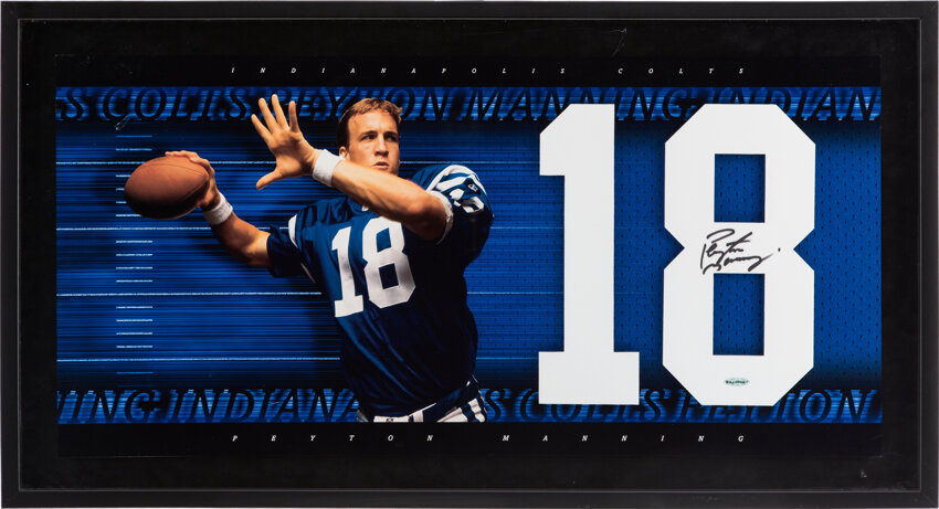 Sold at Auction: Peyton Manning signed and framed jersey PSA