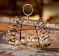 An English 20th century silver-plated toast rack, marked WH. - Bukowskis