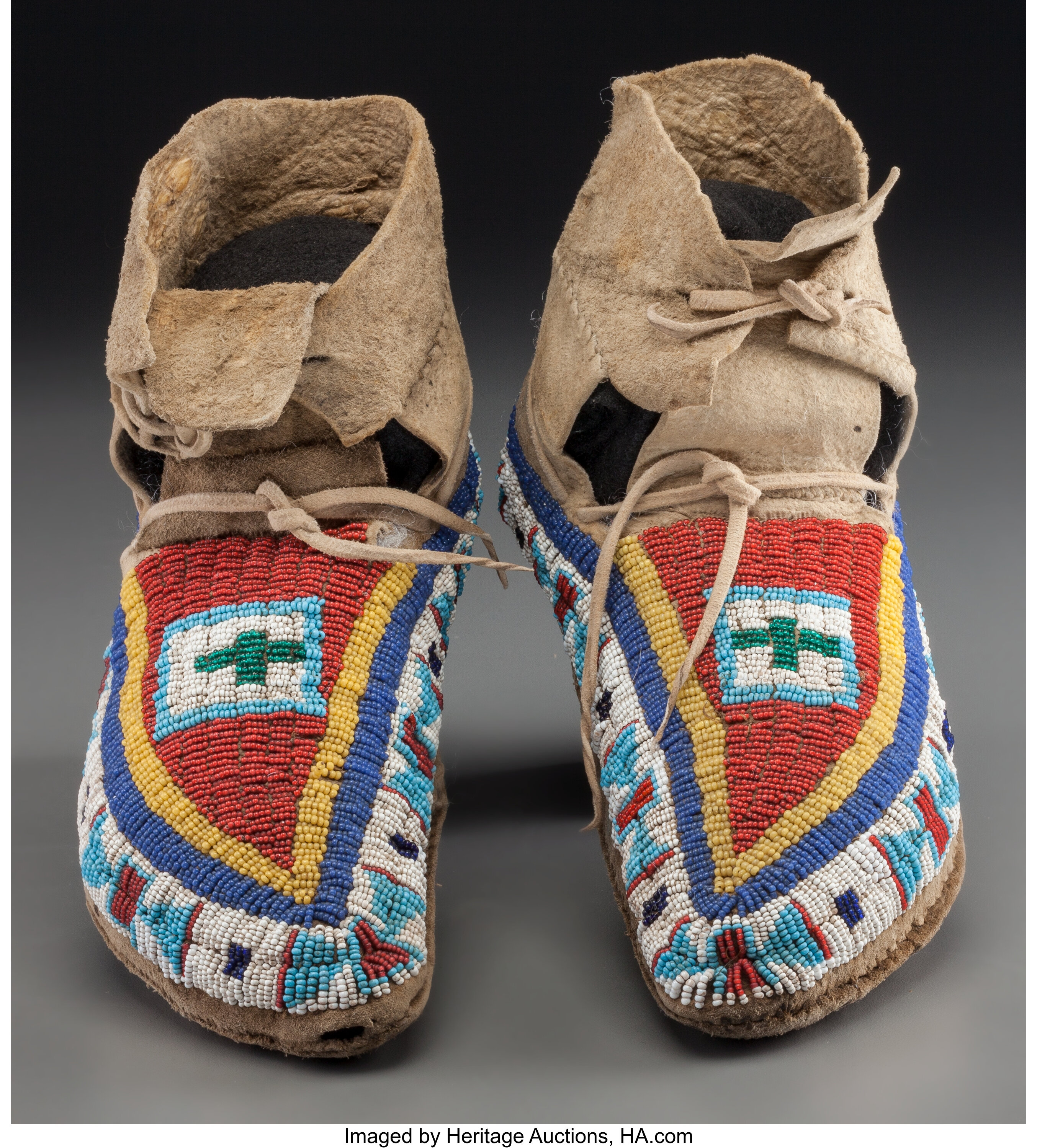 A Pair of Plains Beaded Buffalo Hide Moccasins. c. 1910... (Total ...