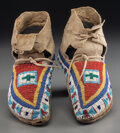 A Pair of Plains Beaded Buffalo Hide Moccasins. c. 1910... (Total ...