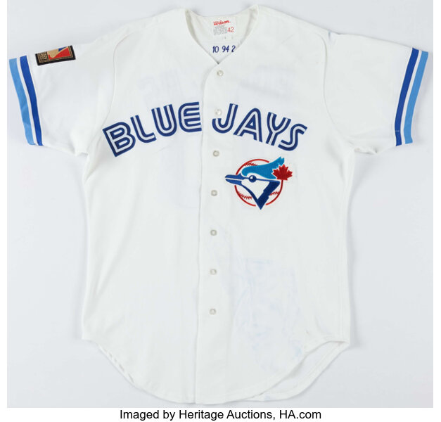 View of a Toronto Blue Jays logo on a jersey worn by a member of