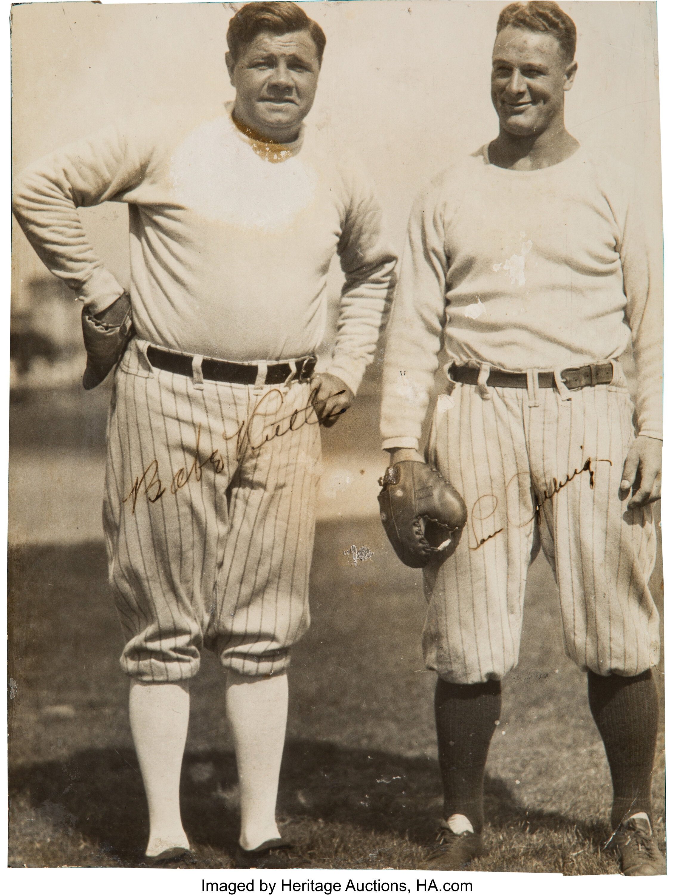 Lou Gehrig, #4 and Babe Ruth #3 exchange laughs at the batting cage in  Yankee Stadium before a game circa 1930. Photo Print 