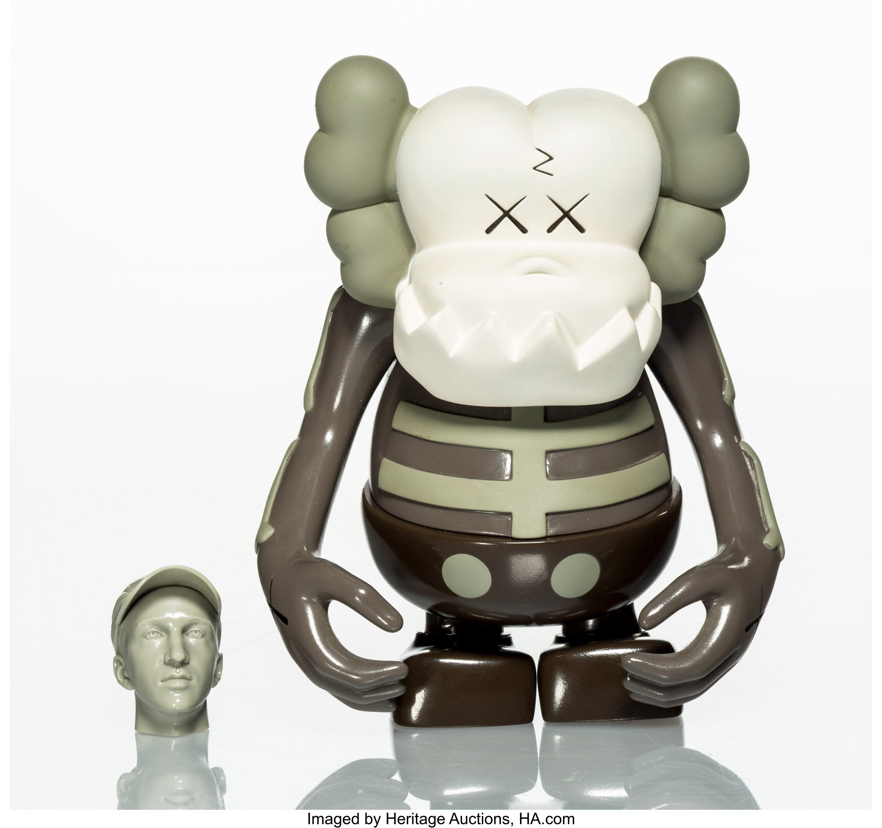 KAWS X Bounty Hunter. Skull Kun (Brown), 2006. Painted cast vinyl