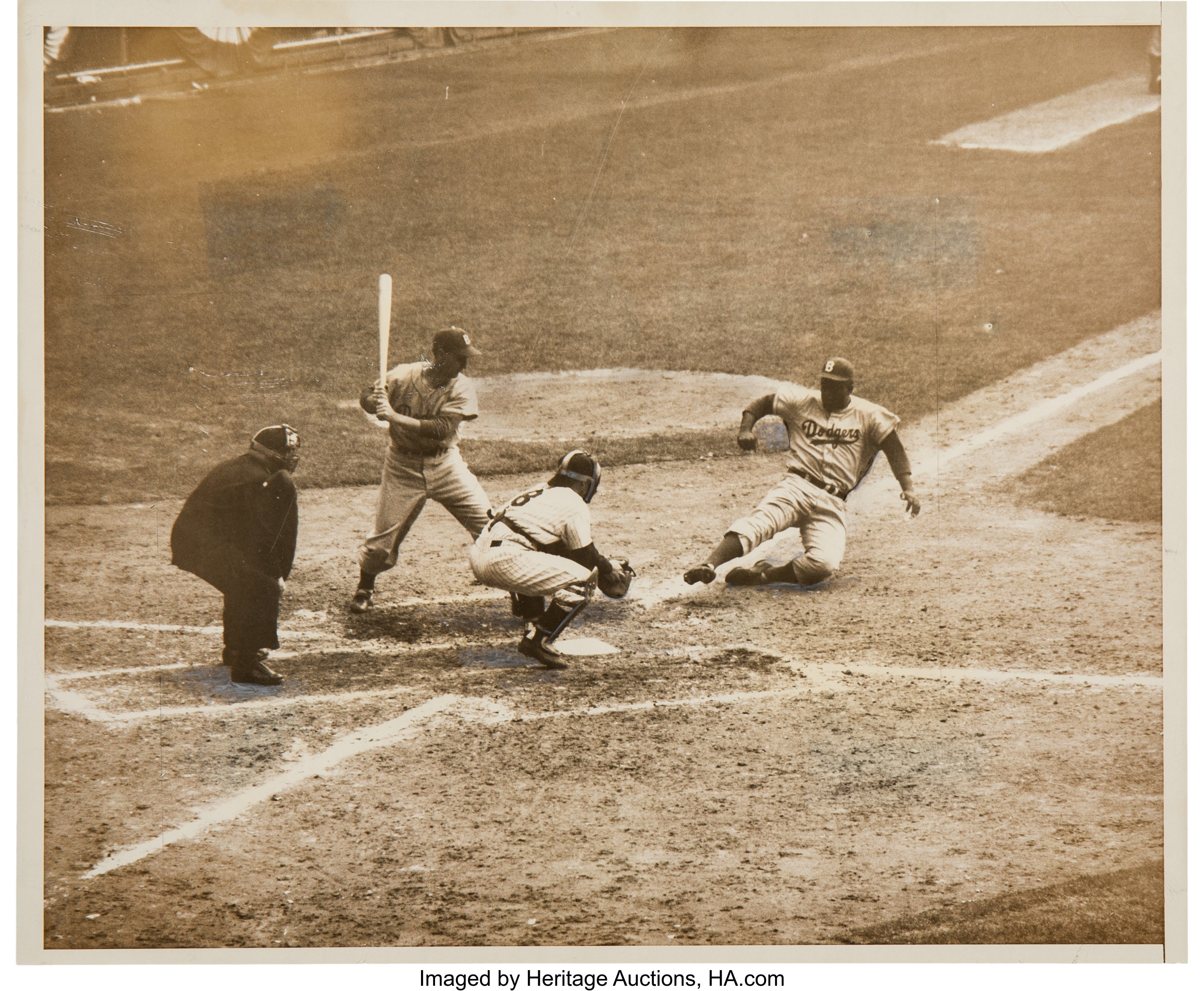 Jackie Robinson Steals And Slides by Bettmann