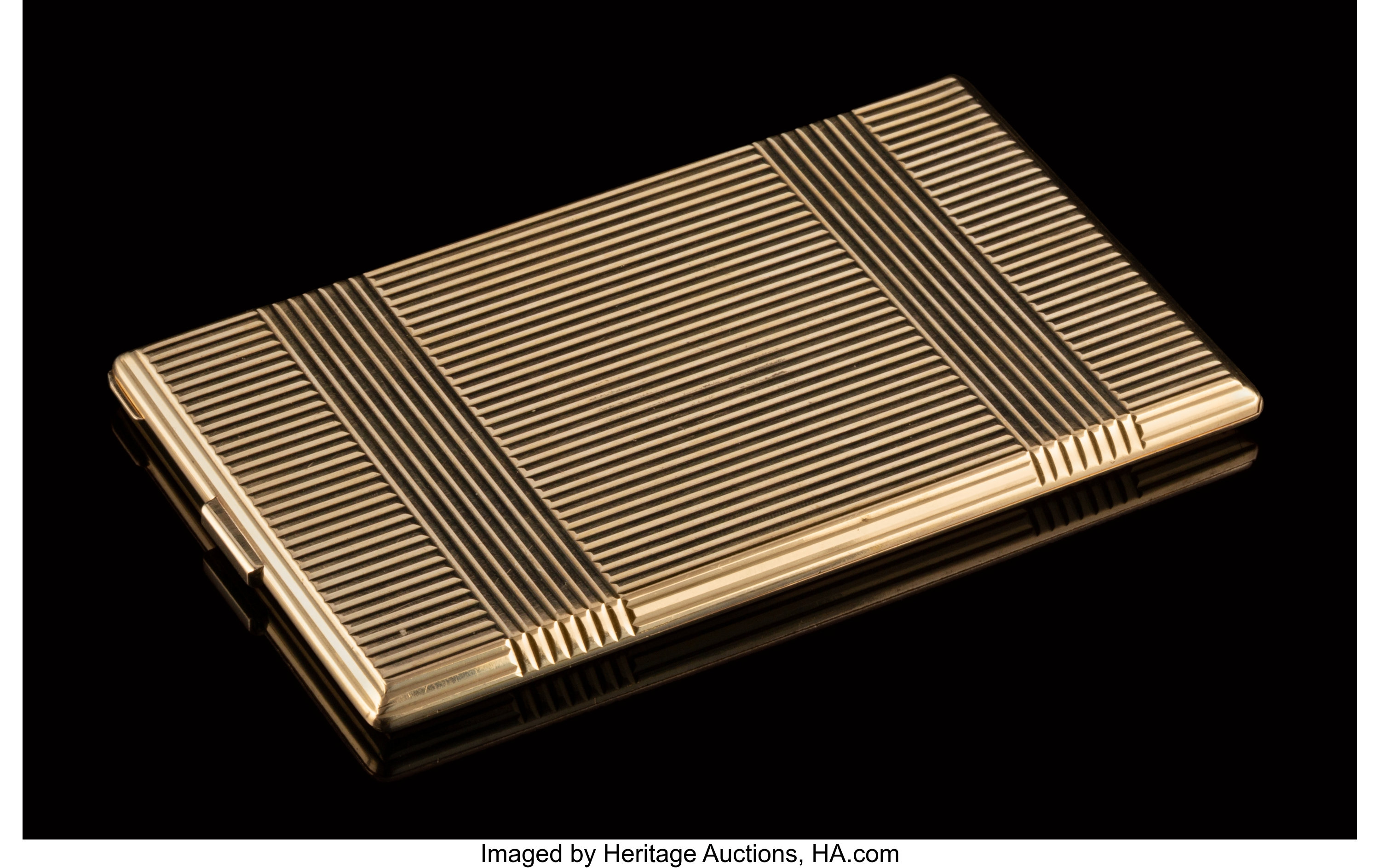 A Cartier 14K Gold Cigarette Case New York circa 1940. Marks