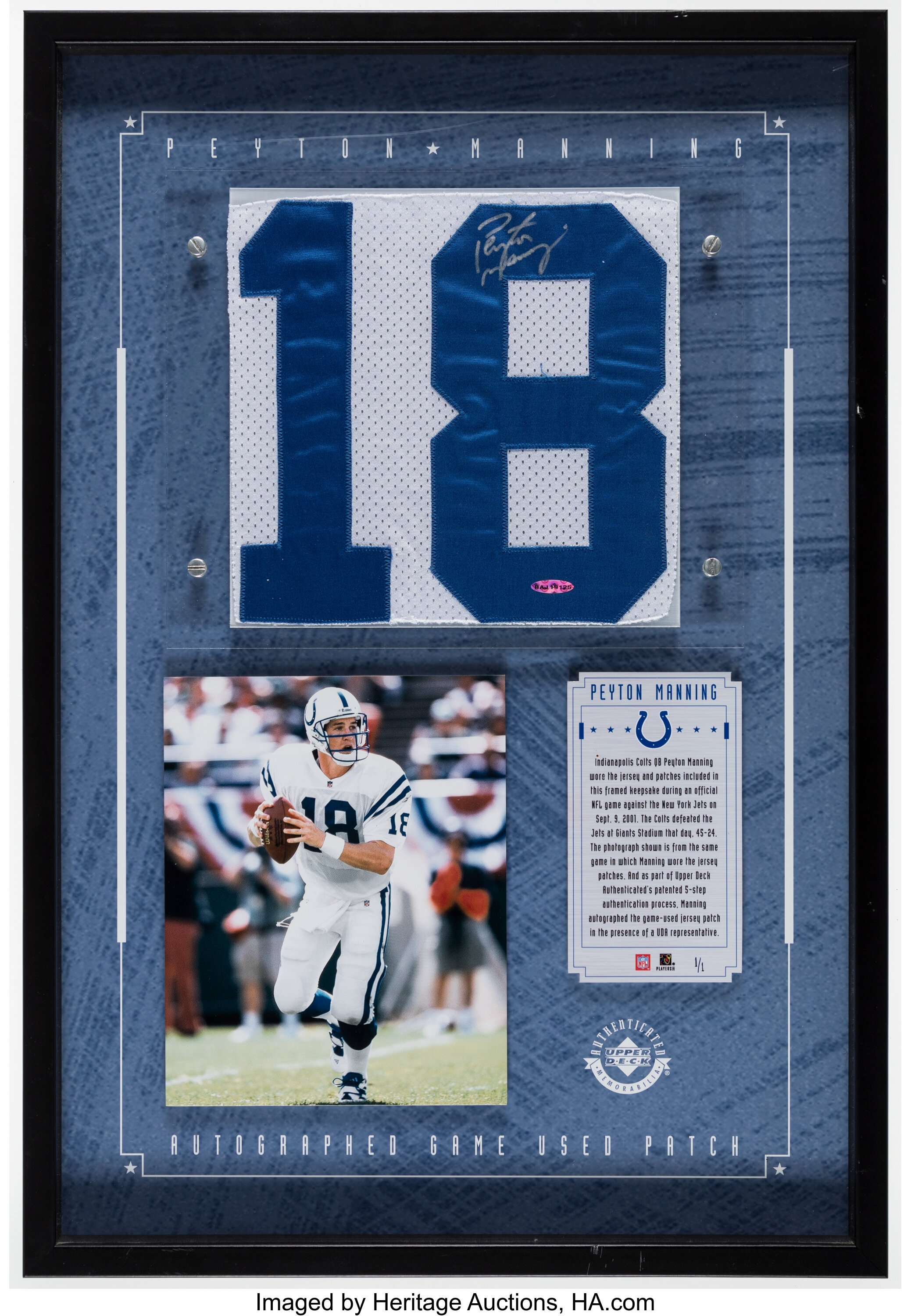 Sold at Auction: Peyton Manning signed and framed jersey PSA