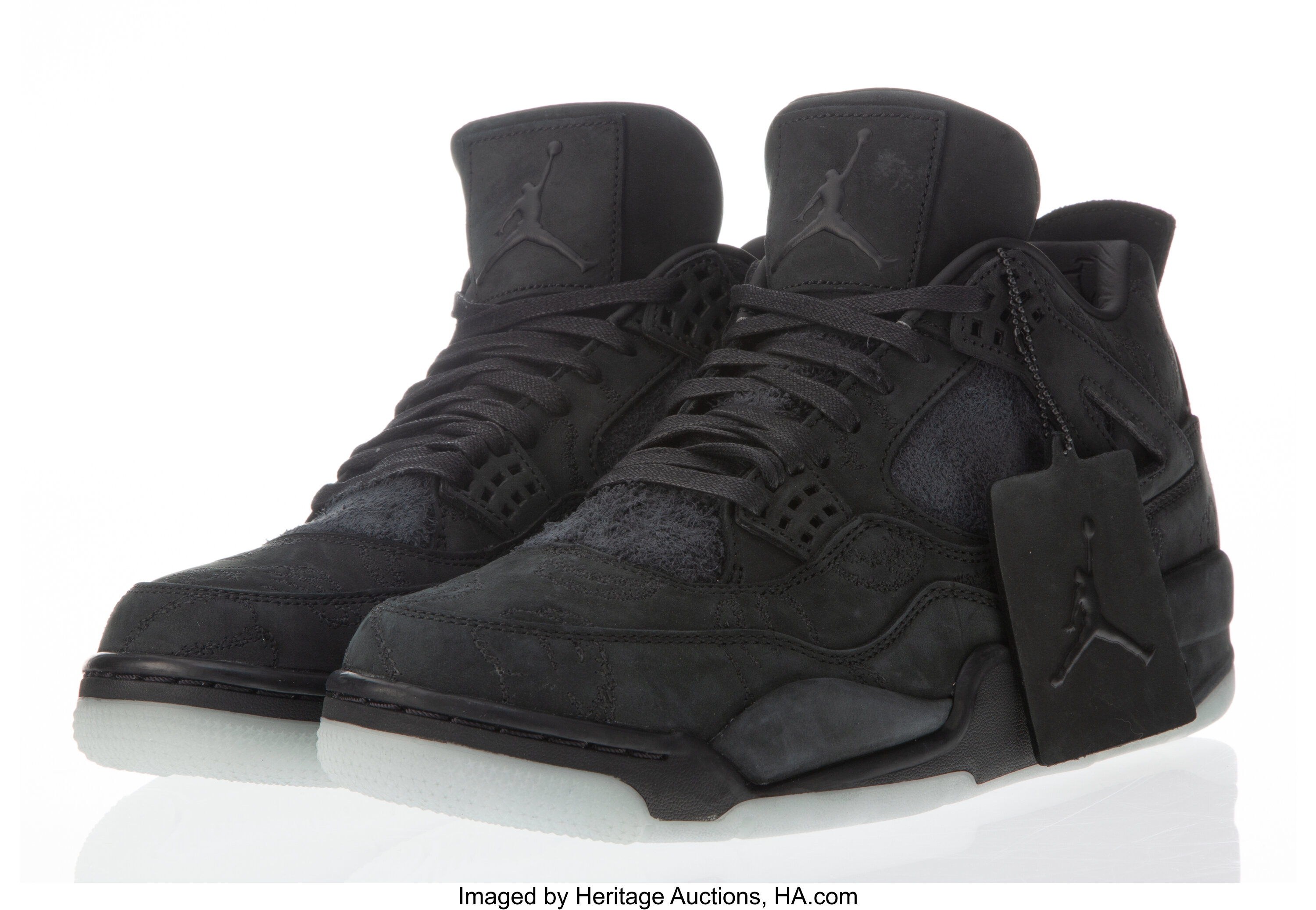 KAWS X Nike. Air Jordan 4 Retro KAWS, 2017. Black sneakers with