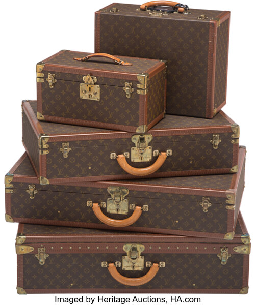 Louis Vuitton, A Group of Four Louis Vuitton Hard-Sided Suitcases