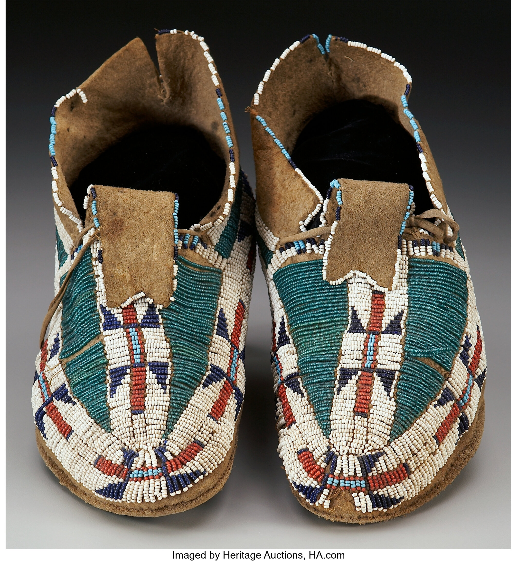 A PAIR OF CHEYENNE BEADED BUFFALO HIDE MOCCASINS. c. 1875. ... | Lot ...