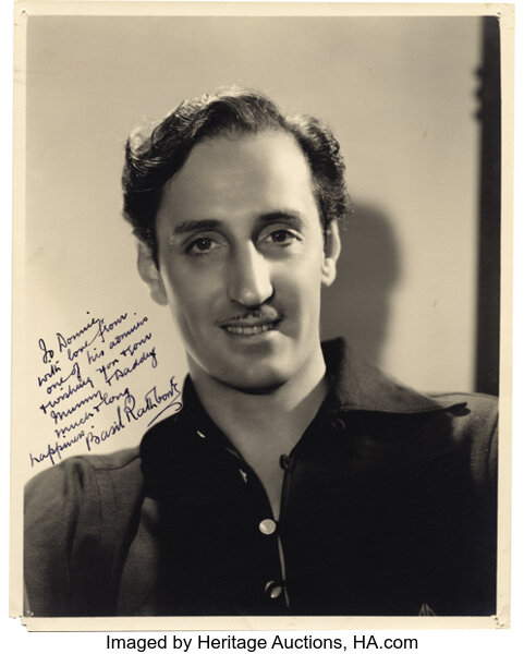 Basil Rathbone Signed Photo to Donnie Dunagan. A b w 8