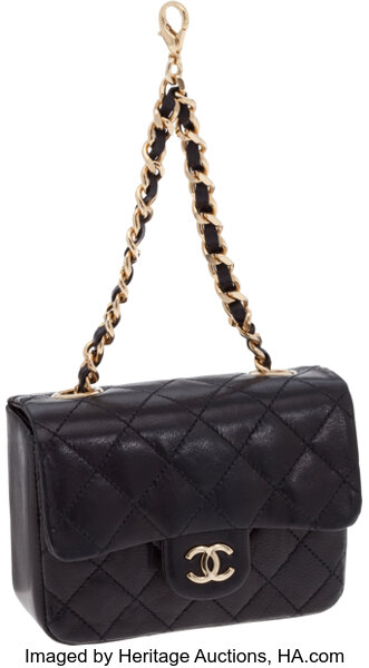 Sold at Auction: A MINI FUR BAG BY CHANEL