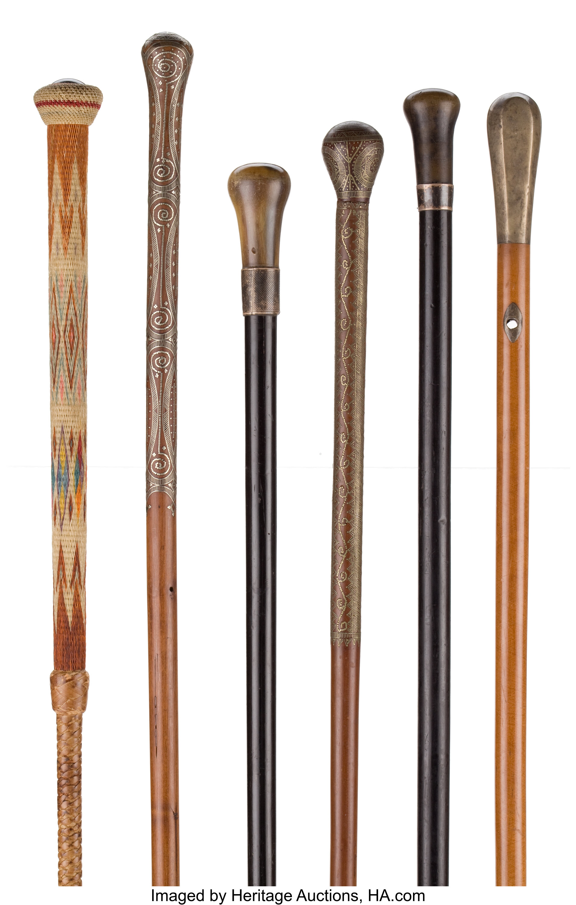 GROUP OF SIX GENTLEMAN'S WALKING STICK CANES . 37 inches overall