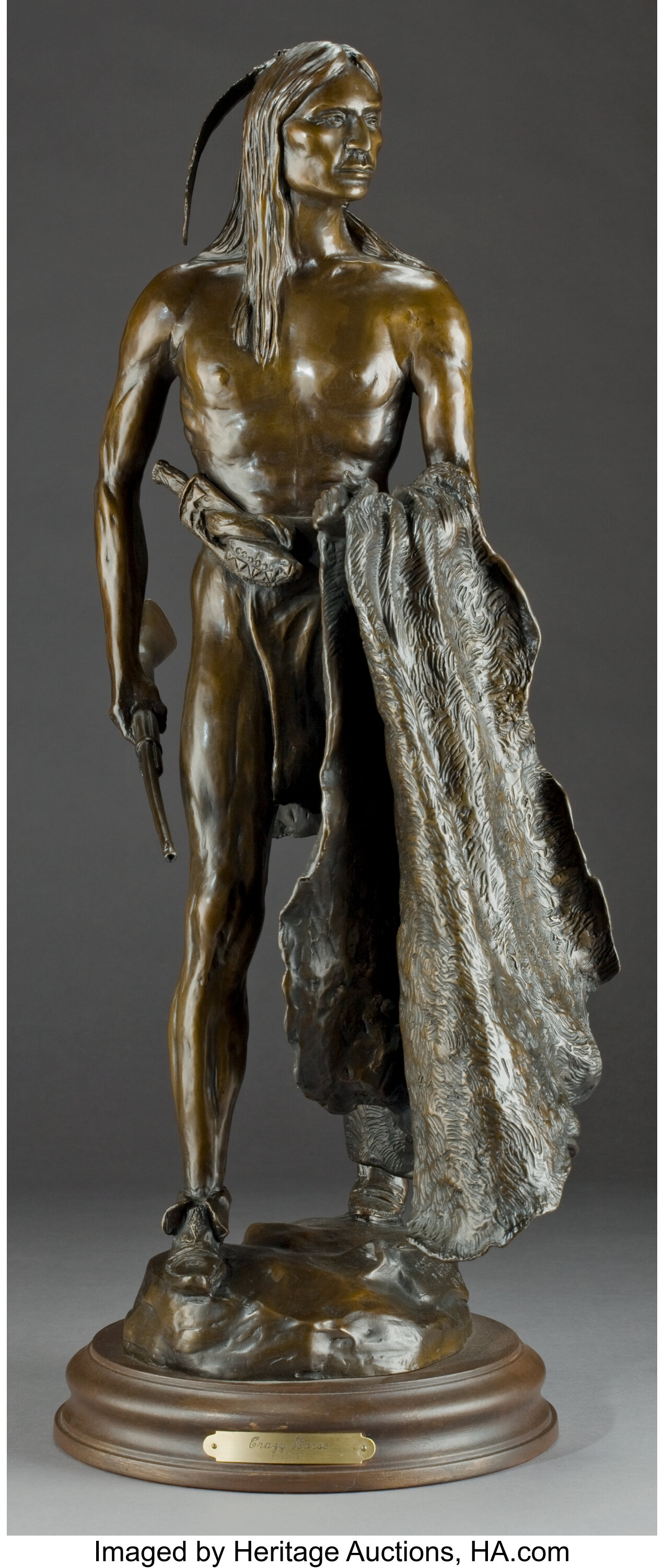 AN AMERICAN FIGURAL PATINATED BRONZE: CRAZY HORSE . P. Geiger, | Lot ...