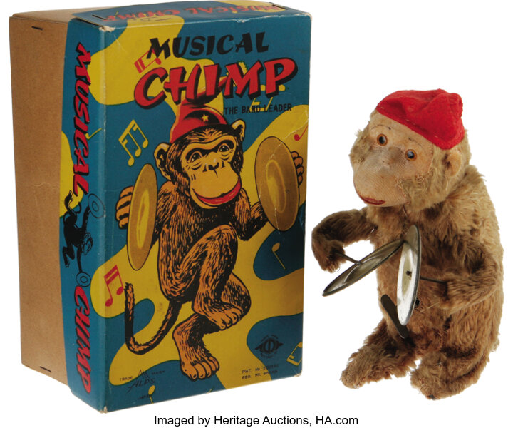 Wind-Up Musical Chimp Toy. Vintage wind-up chimp toy with
