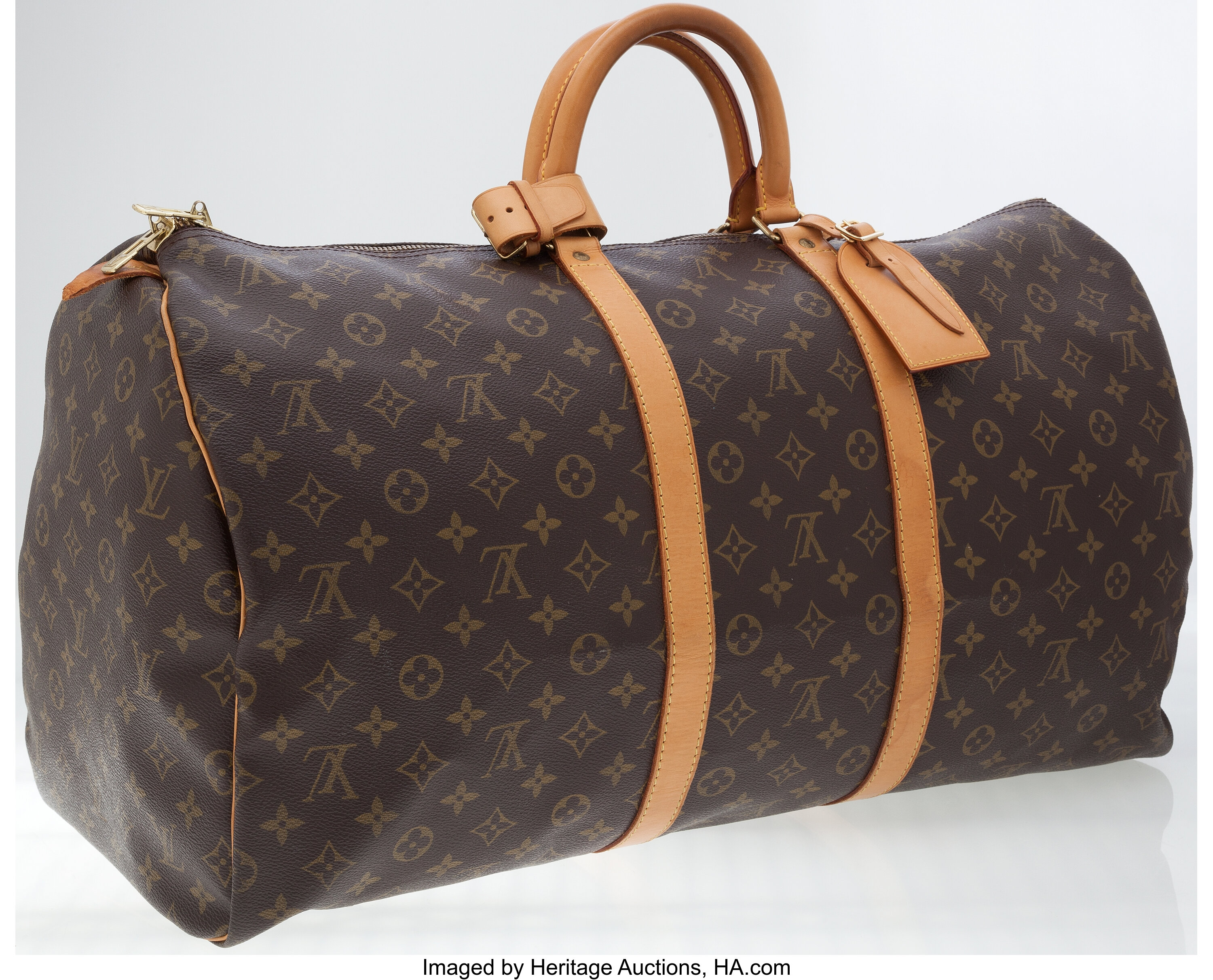 Lot - A Louis Vuitton leather trimmed monogram canvas duffle bag