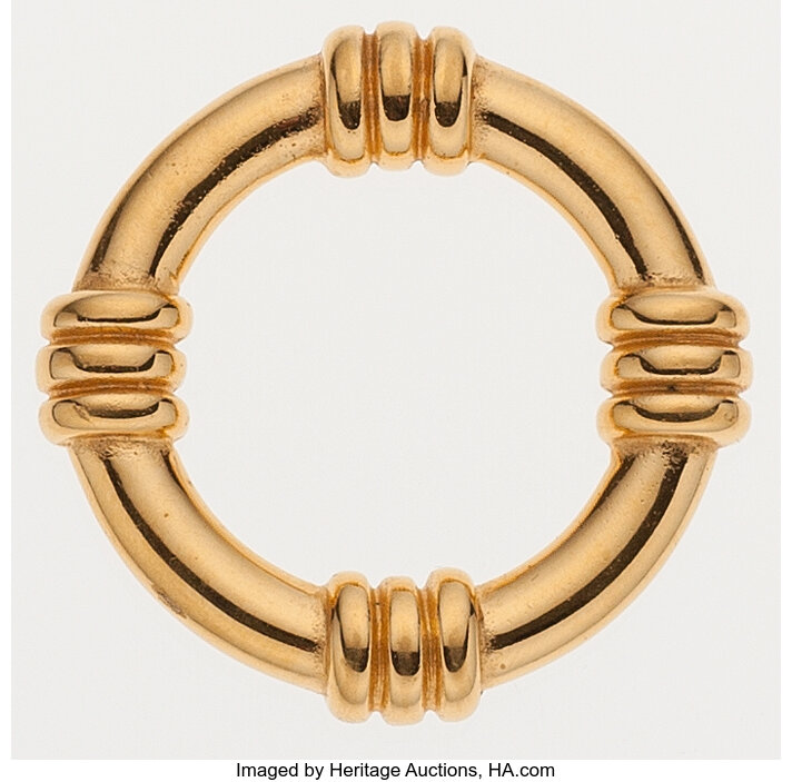 Sold at Auction: HERMES 14K GOLD SCARF RING.