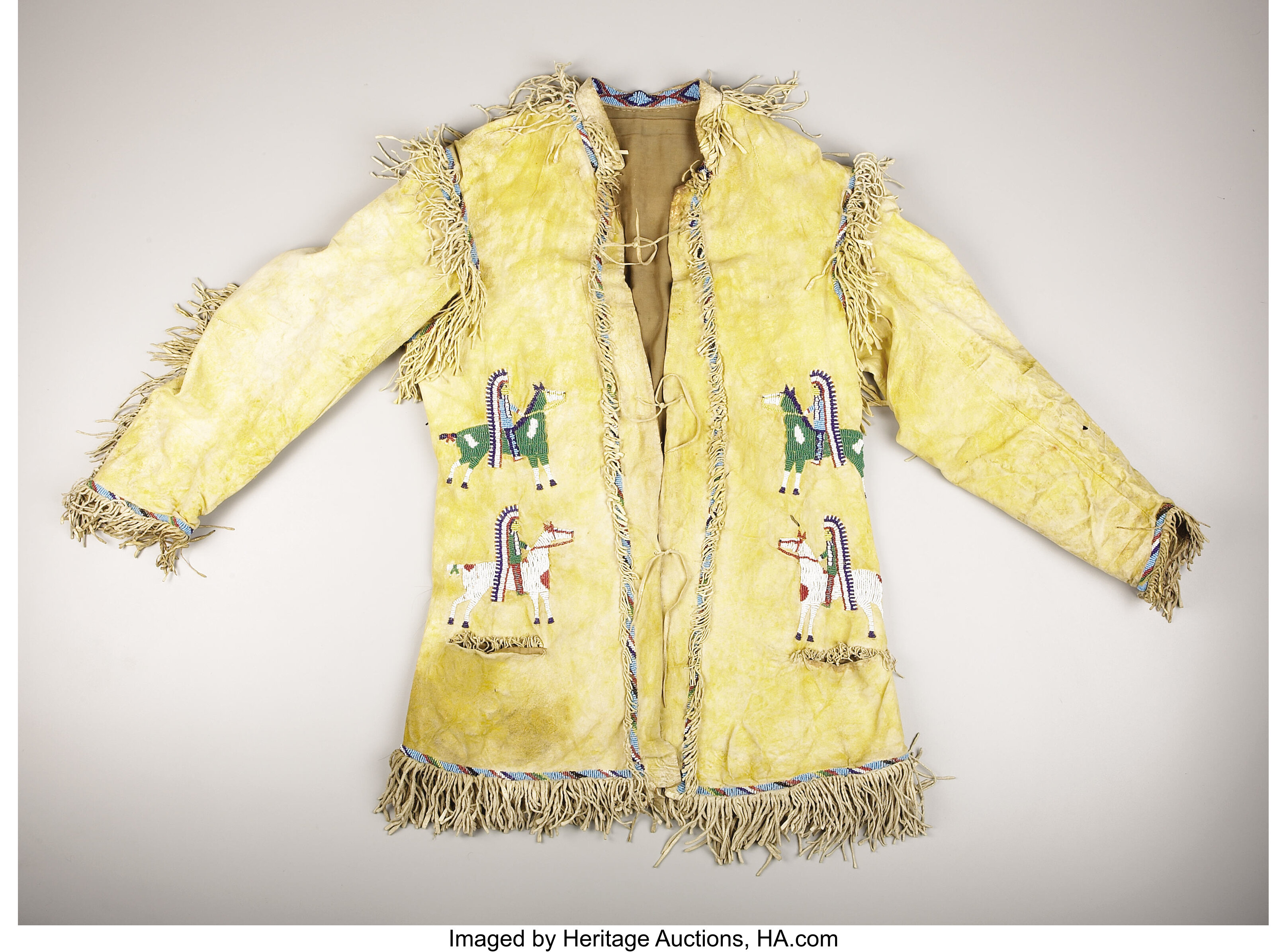 A SIOUX PICTORIAL BEADED AND FRINGED HIDE JACKET. . c. 1890. ... | Lot ...